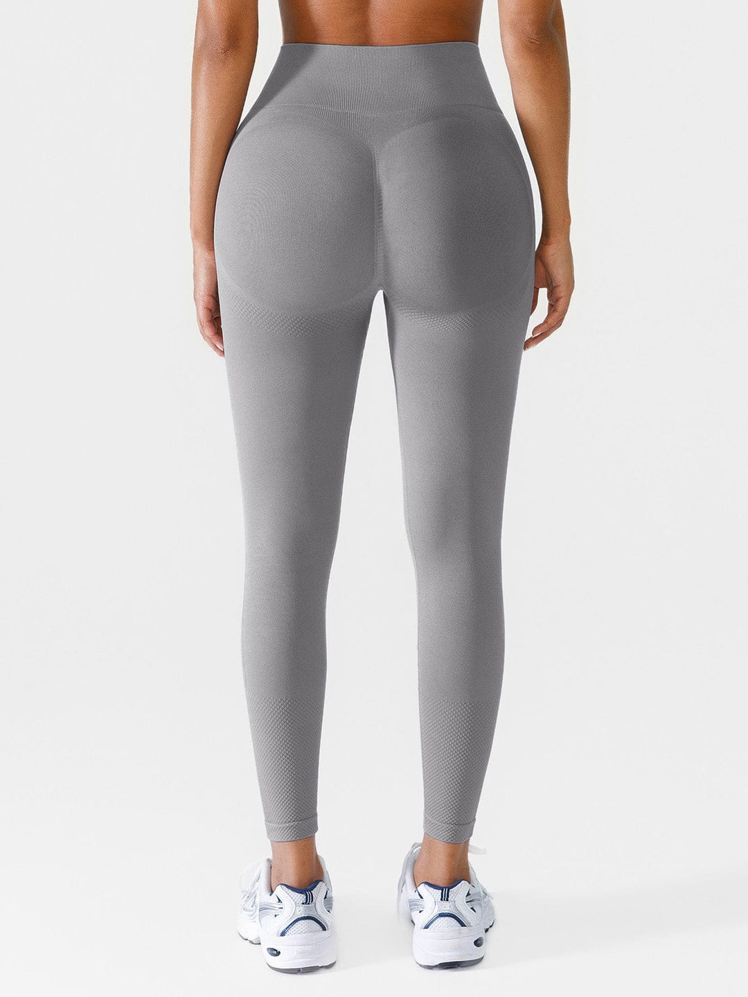 A model wearing a BRXL® Seamless Butt Scrunch Spandx Leggings With Tummy Control in