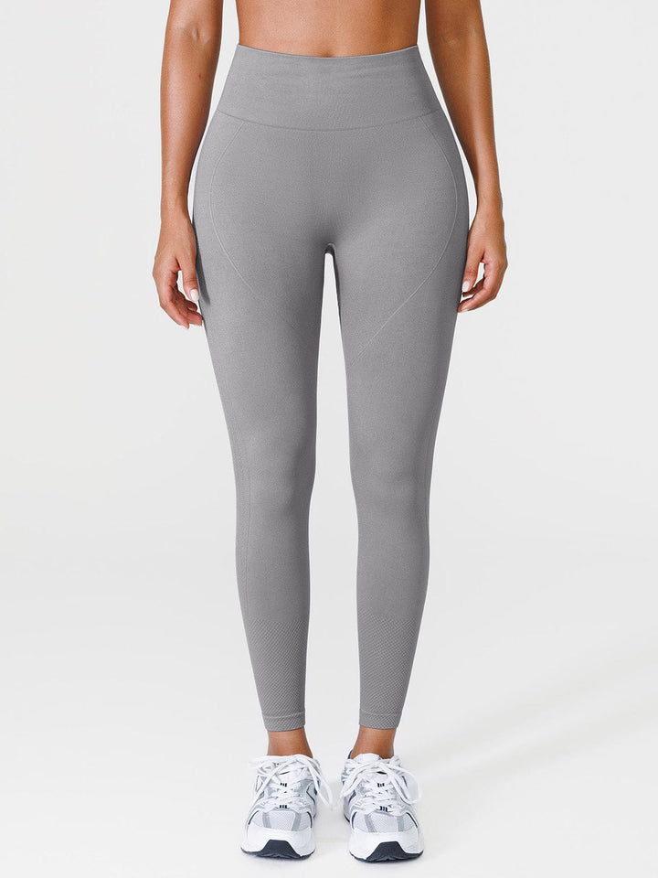 A model wearing a BRXL® Seamless Butt Scrunch Spandx Leggings With Tummy Control in