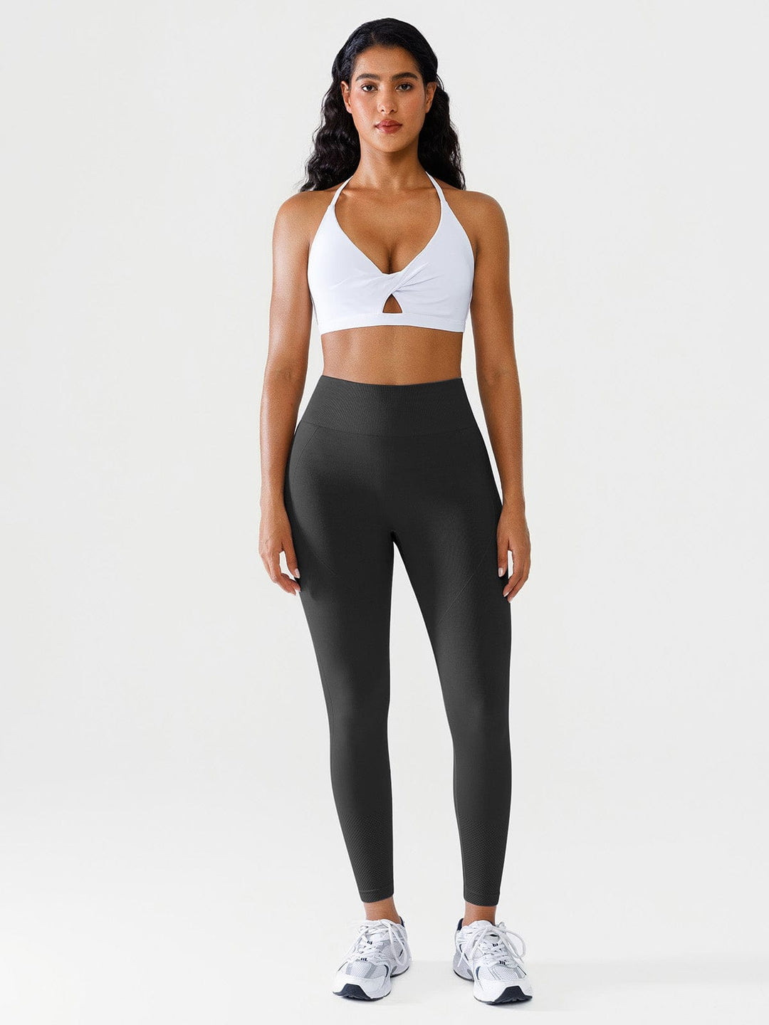 A model wearing a BRXL® Seamless Butt Scrunch Spandx Leggings With Tummy Control in