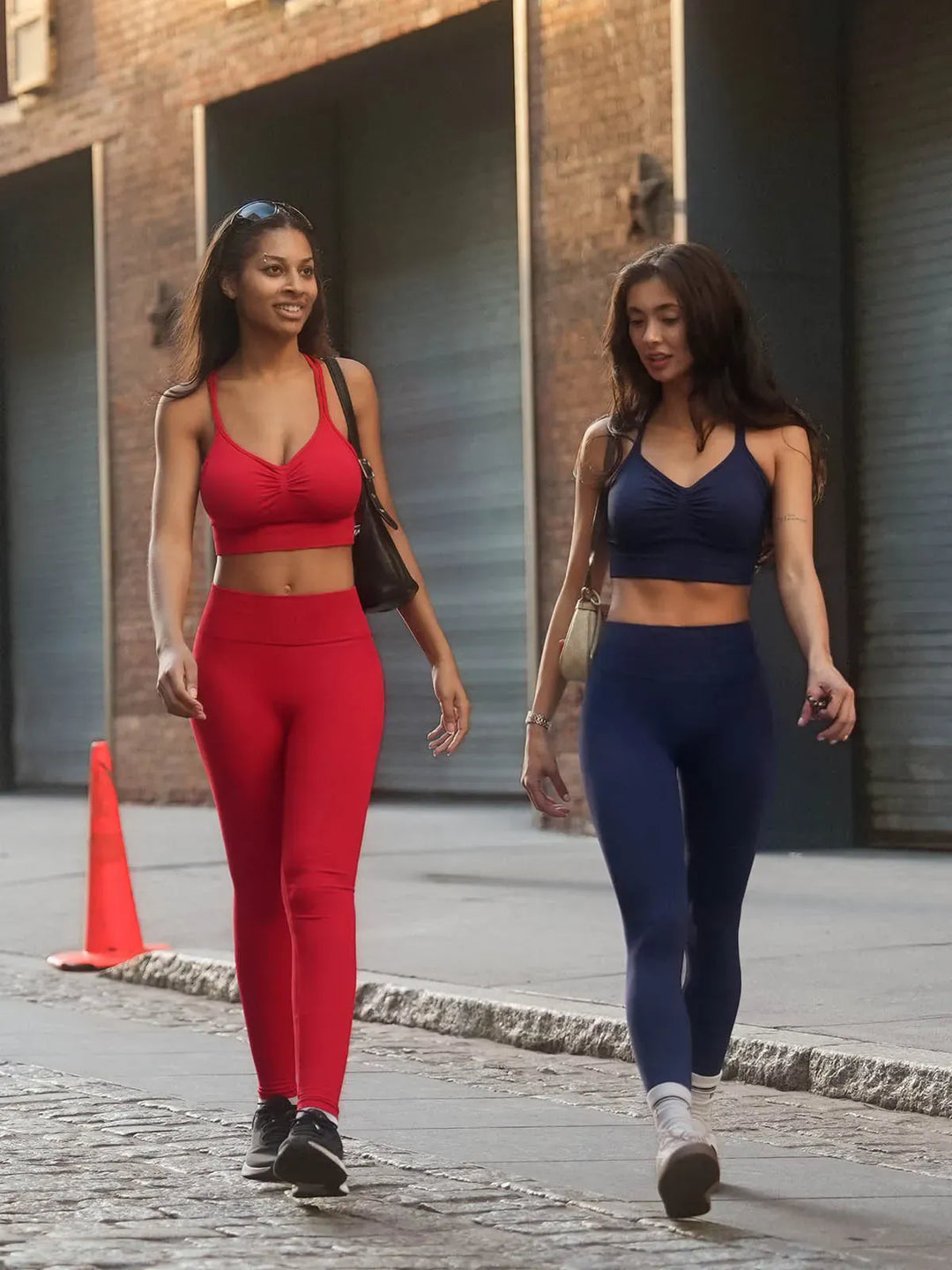 A model wearing a BRXL® Seamless Criss Cross Spaghetti Racerback Sports Bra in