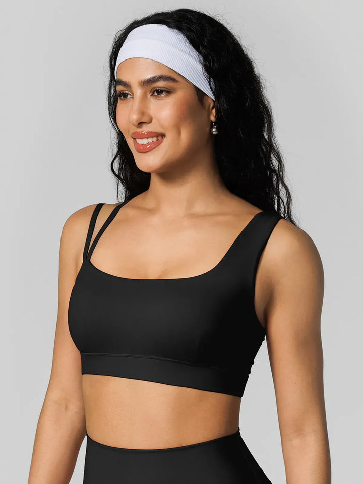 A model wearing a BRXL® Seamless Dual Style Square Neckline Sports Bra