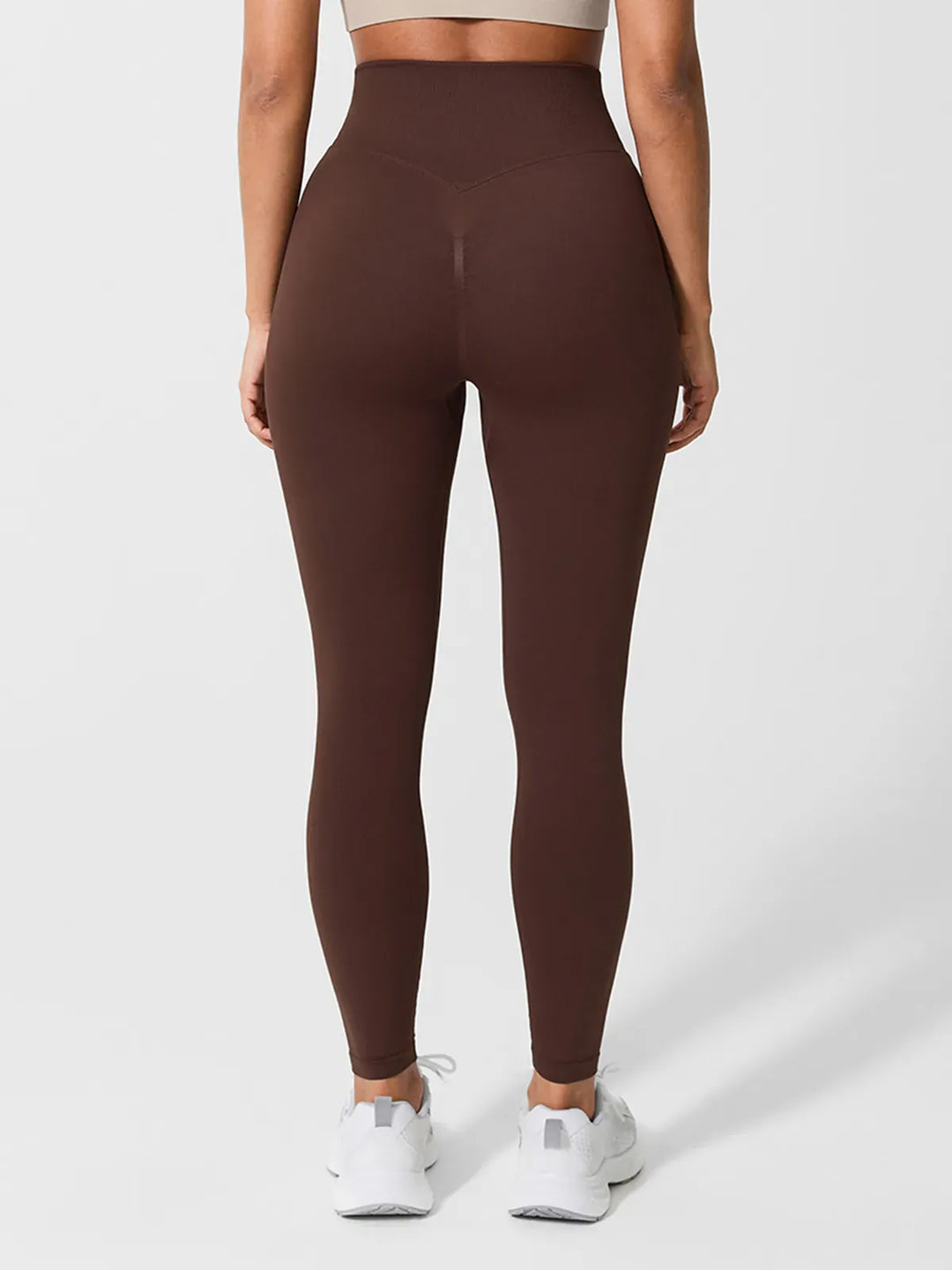 A model wearing a BRXL® Seamless High Waisted Butt-Lifting Leggings in