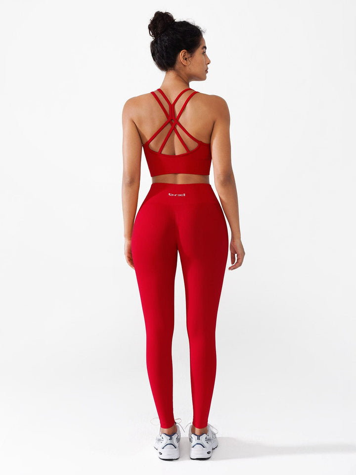 A model wearing a BRXL® Seamless High Waisted Butt-Lifting Leggings,Half Front Zipper Activewear Cropped Top in