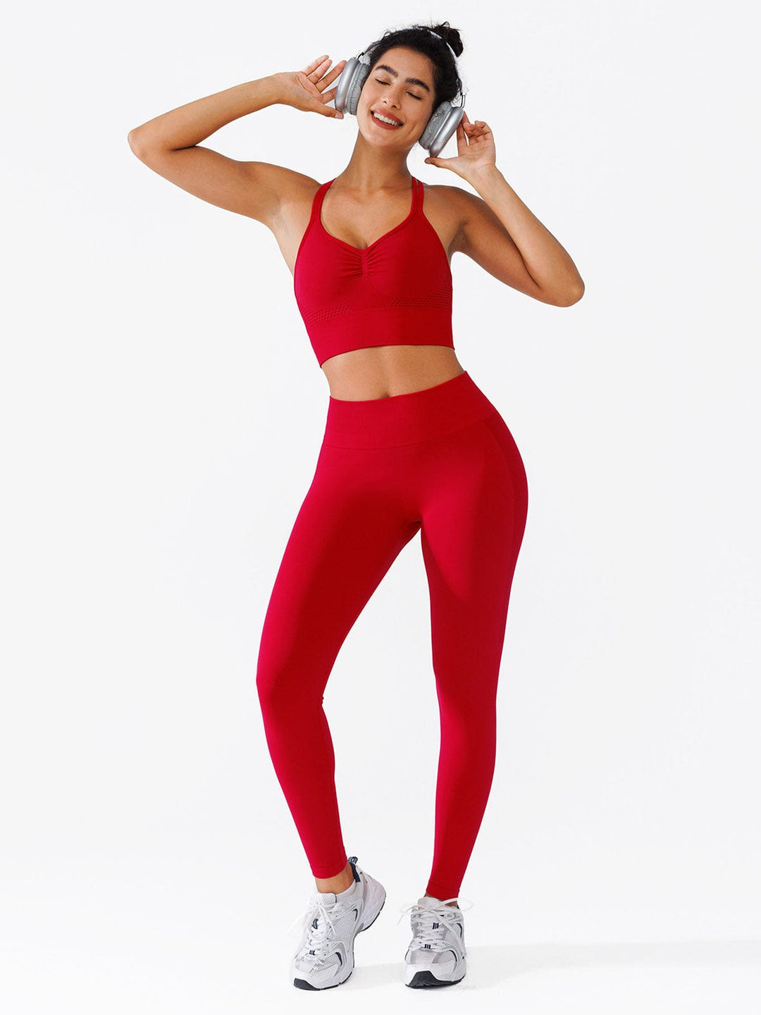 A model wearing a BRXL® Seamless High Waisted Butt-Lifting Leggings,Half Front Zipper Activewear Cropped Top in