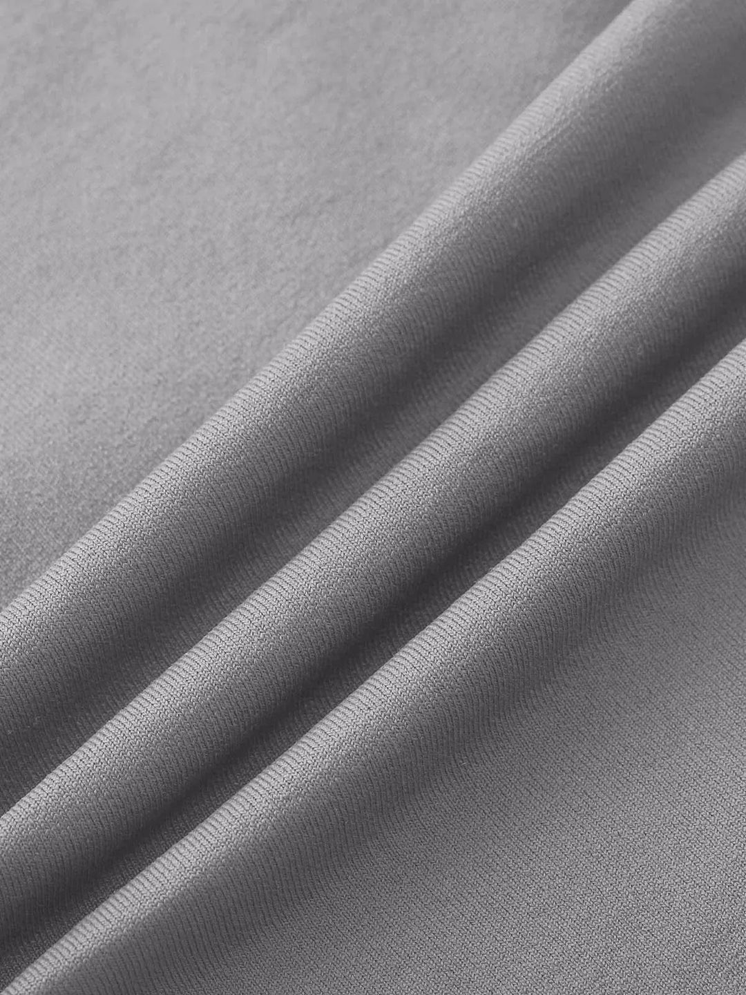 A model wearing a BRXL® Seamless High Waisted Tummy Control Butt-Lifting Leggings,Half Front Zipper Activewear Cropped Top in