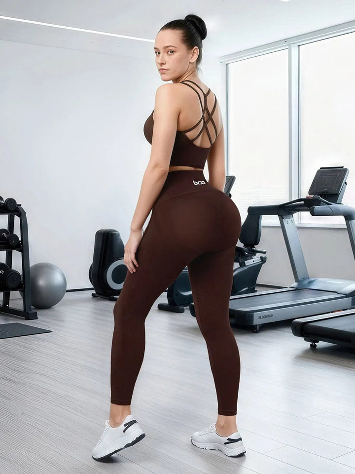 A model wearing a BRXL® Seamless High Waisted Tummy Control Butt-Lifting Leggings,Half Front Zipper Activewear Cropped Top in