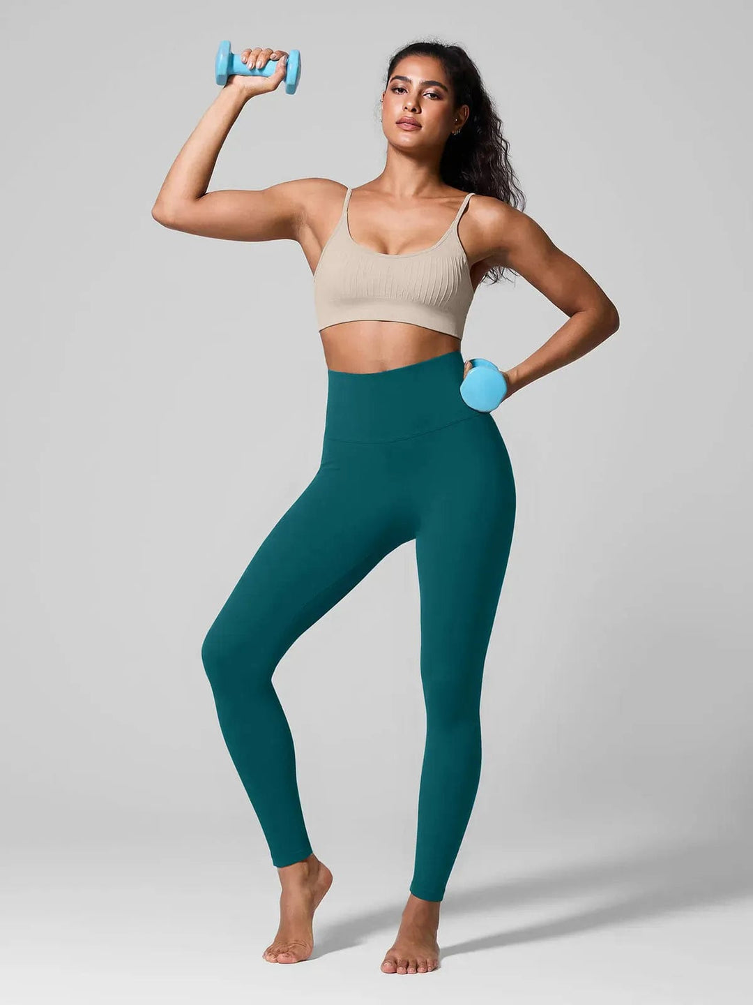 A model wearing a BRXL® Seamless High Waisted Tummy Control Butt-Lifting Leggings,Half Front Zipper Activewear Cropped Top in