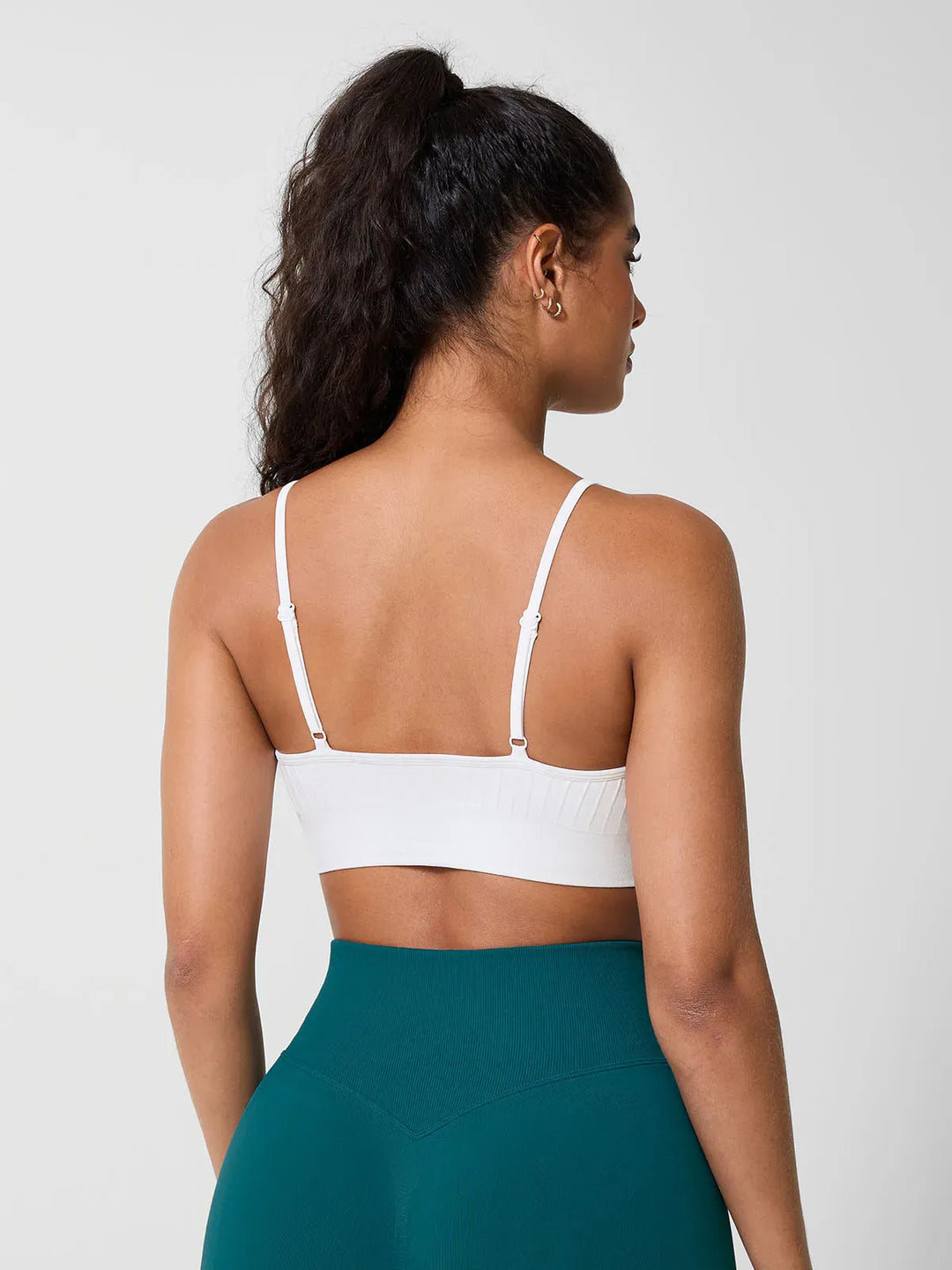 A model wearing a BRXL® Seamless Scoop Ribbed Sports Bra