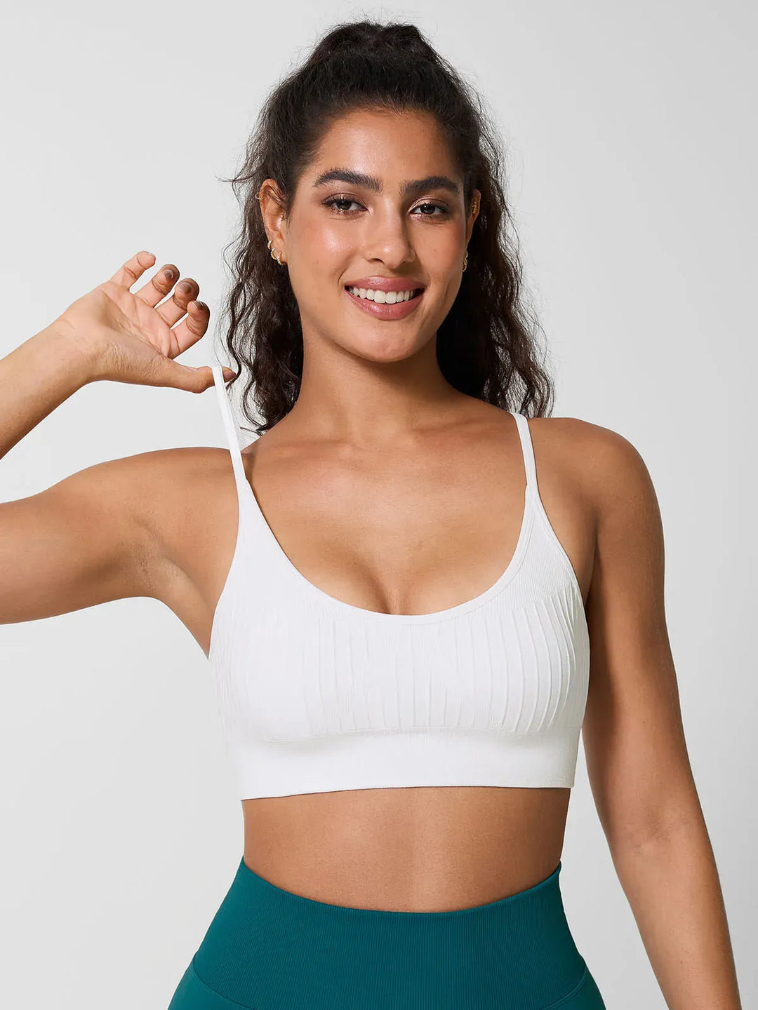 A model wearing a BRXL® Seamless Scoop Ribbed Sports Bra