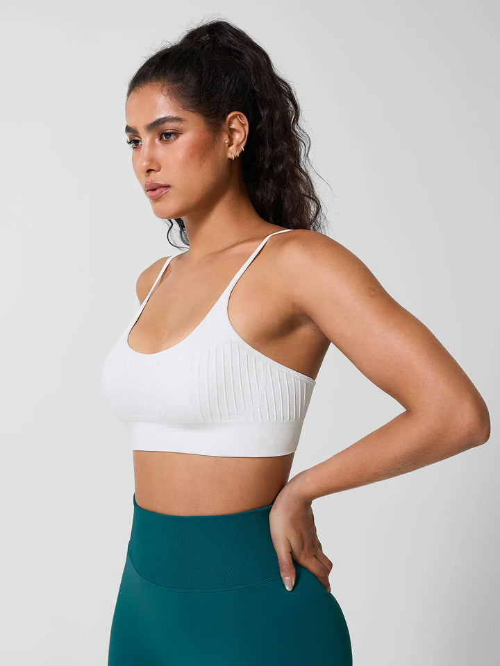 A model wearing a BRXL® Seamless Scoop Ribbed Sports Bra
