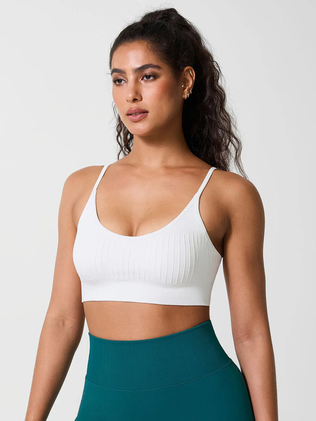 A model wearing a BRXL® Seamless Scoop Ribbed Sports Bra
