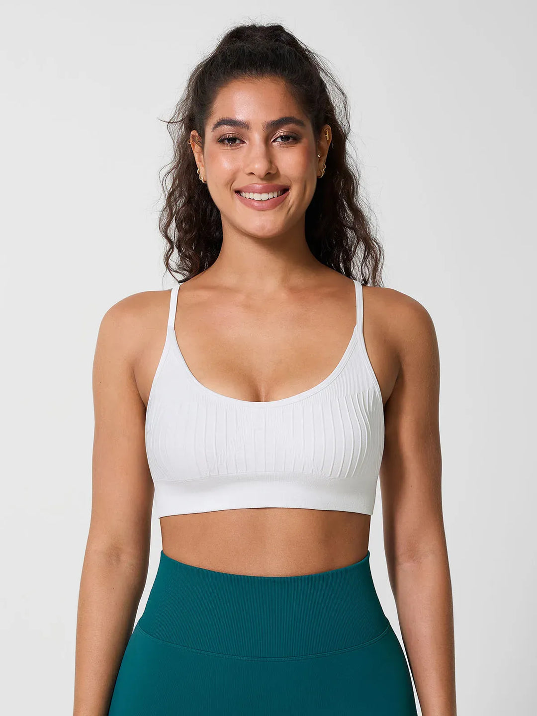 A model wearing a BRXL® Seamless Scoop Ribbed Sports Bra
