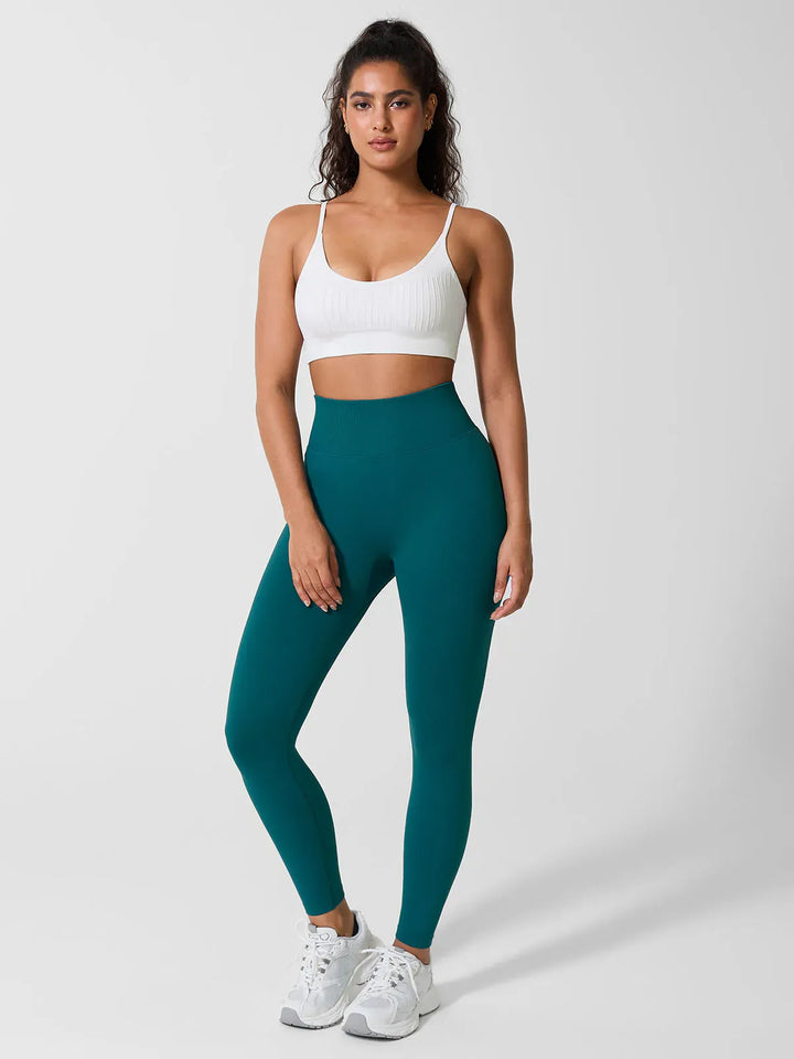 A model wearing a BRXL® Seamless Scoop Ribbed Sports Bra