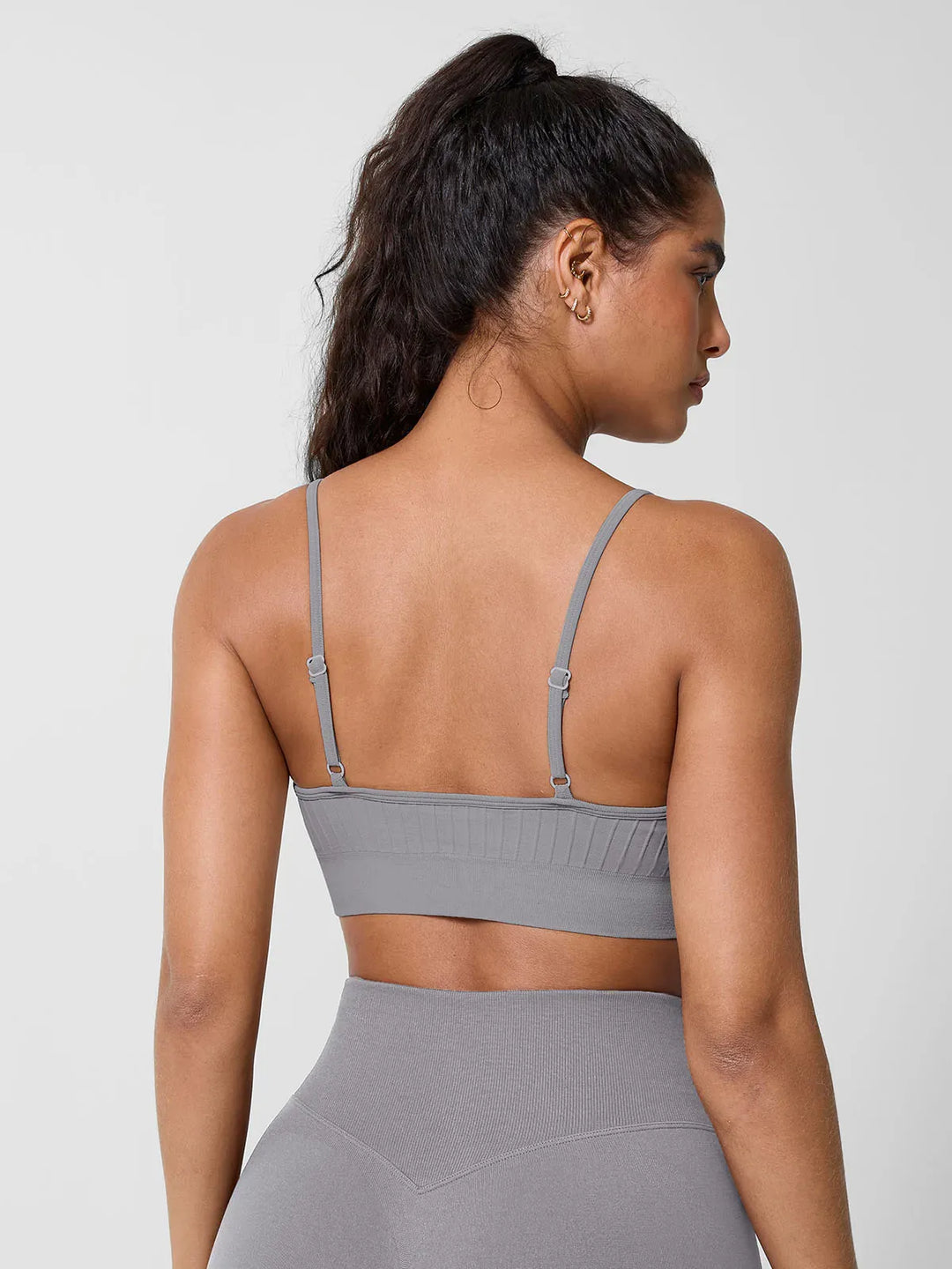 A model wearing a BRXL® Seamless Scoop Ribbed Sports Bra