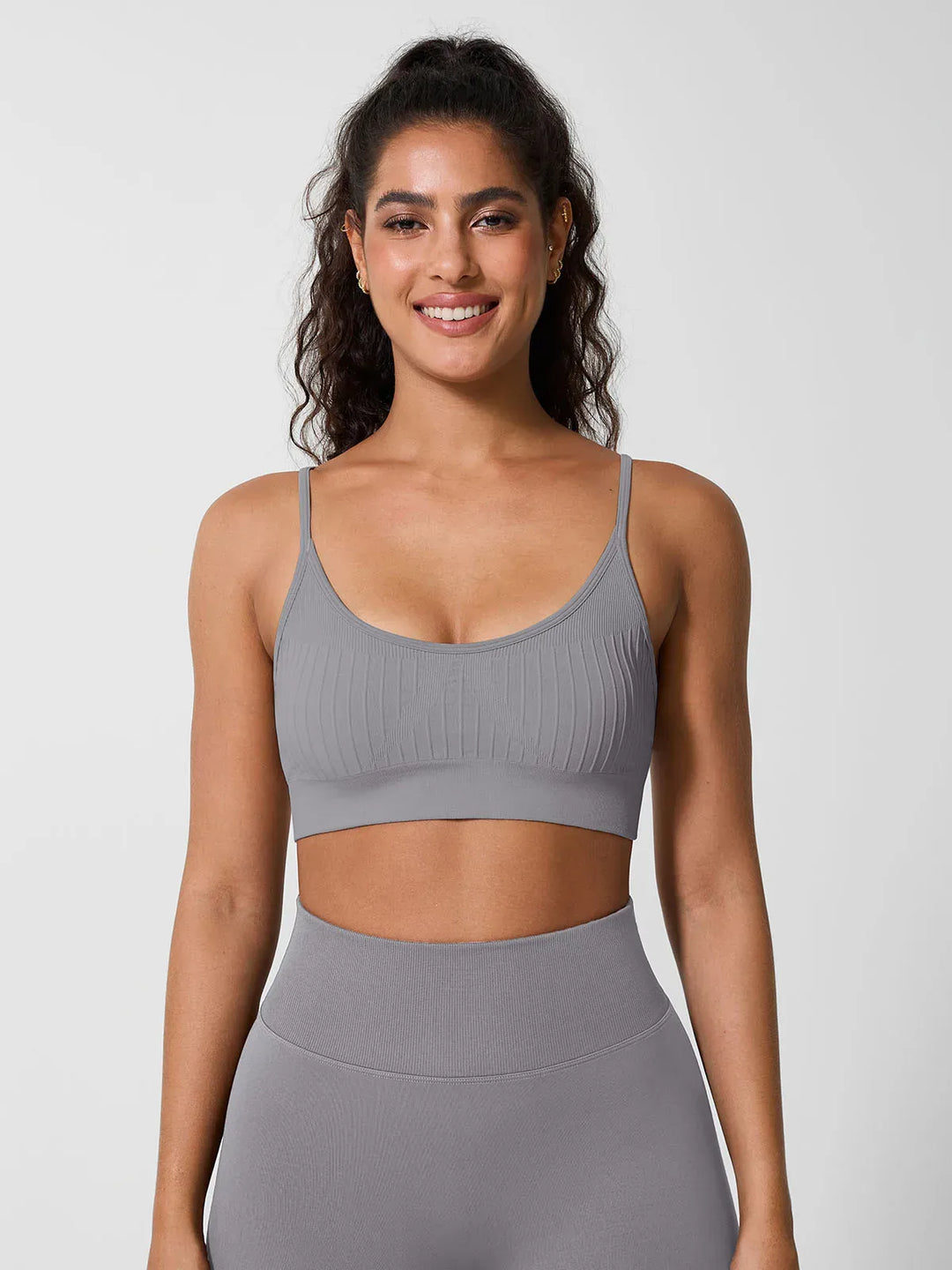 A model wearing a BRXL® Seamless Scoop Ribbed Sports Bra