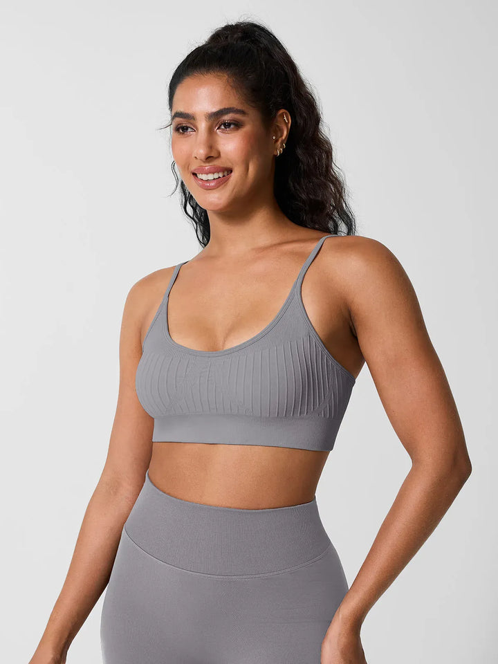 A model wearing a BRXL® Seamless Scoop Ribbed Sports Bra