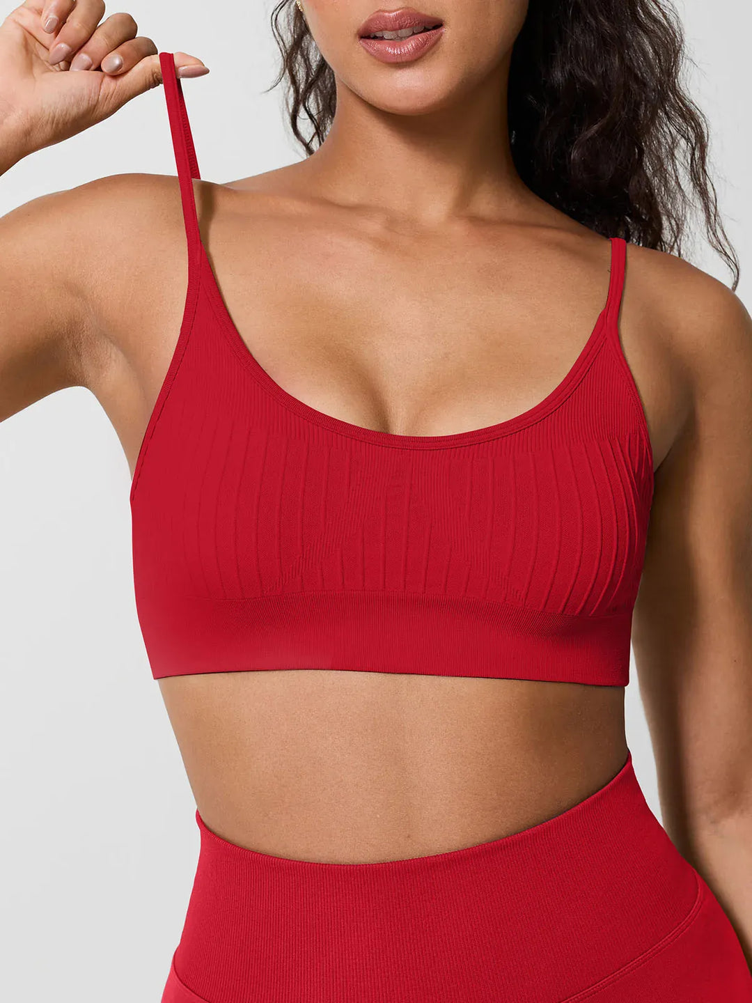 A model wearing a BRXL® Seamless Scoop Ribbed Sports Bra