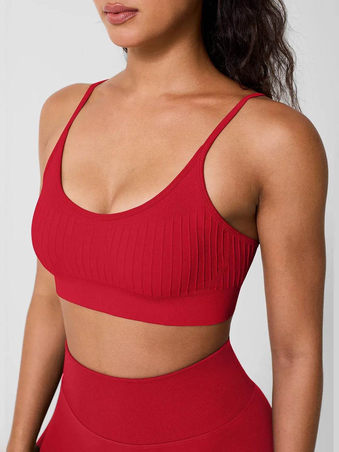 A model wearing a BRXL® Seamless Scoop Ribbed Sports Bra