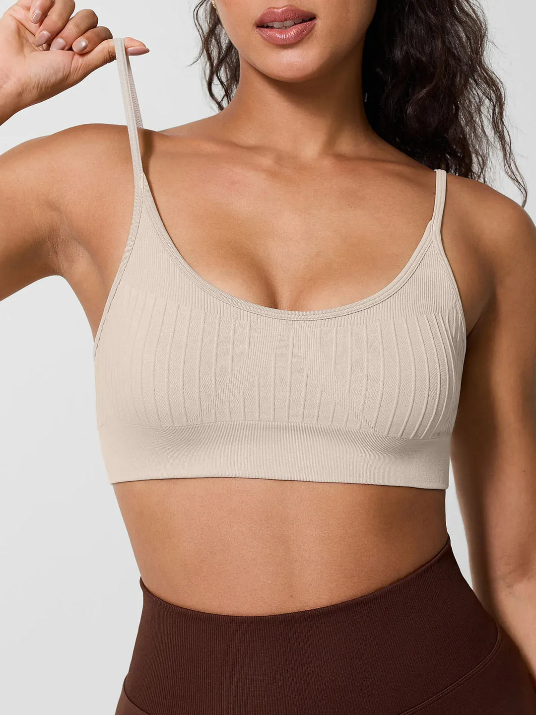 A model wearing a BRXL® Seamless Scoop Ribbed Sports Bra