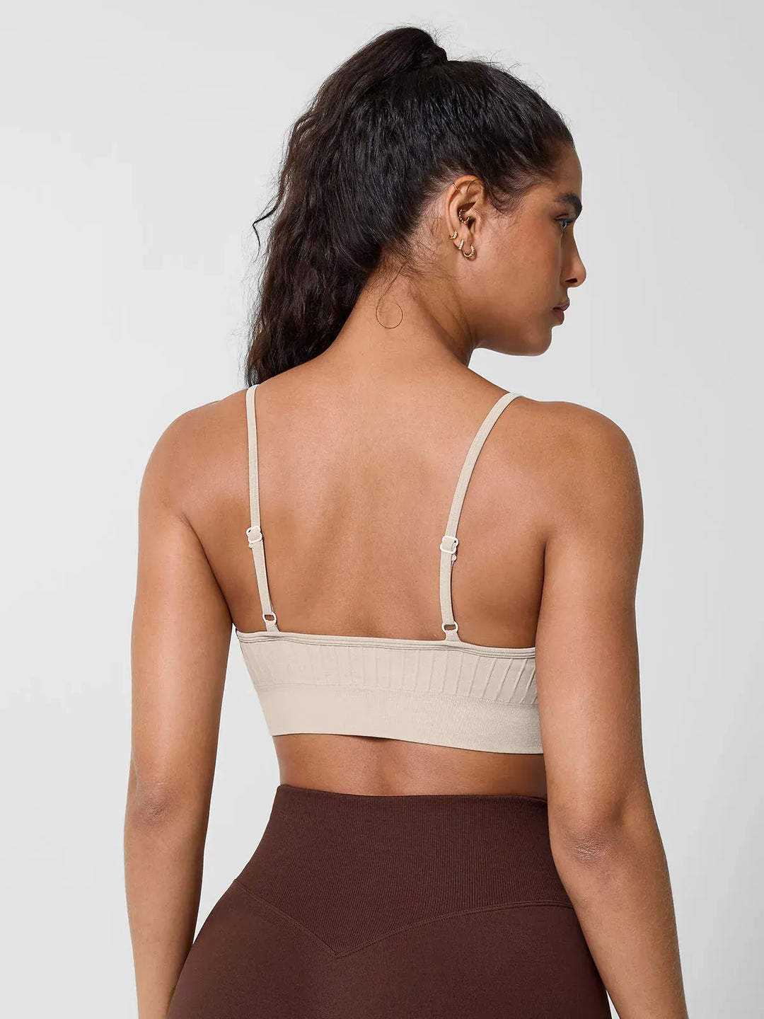 A model wearing a BRXL® Seamless Scoop Ribbed Sports Bra