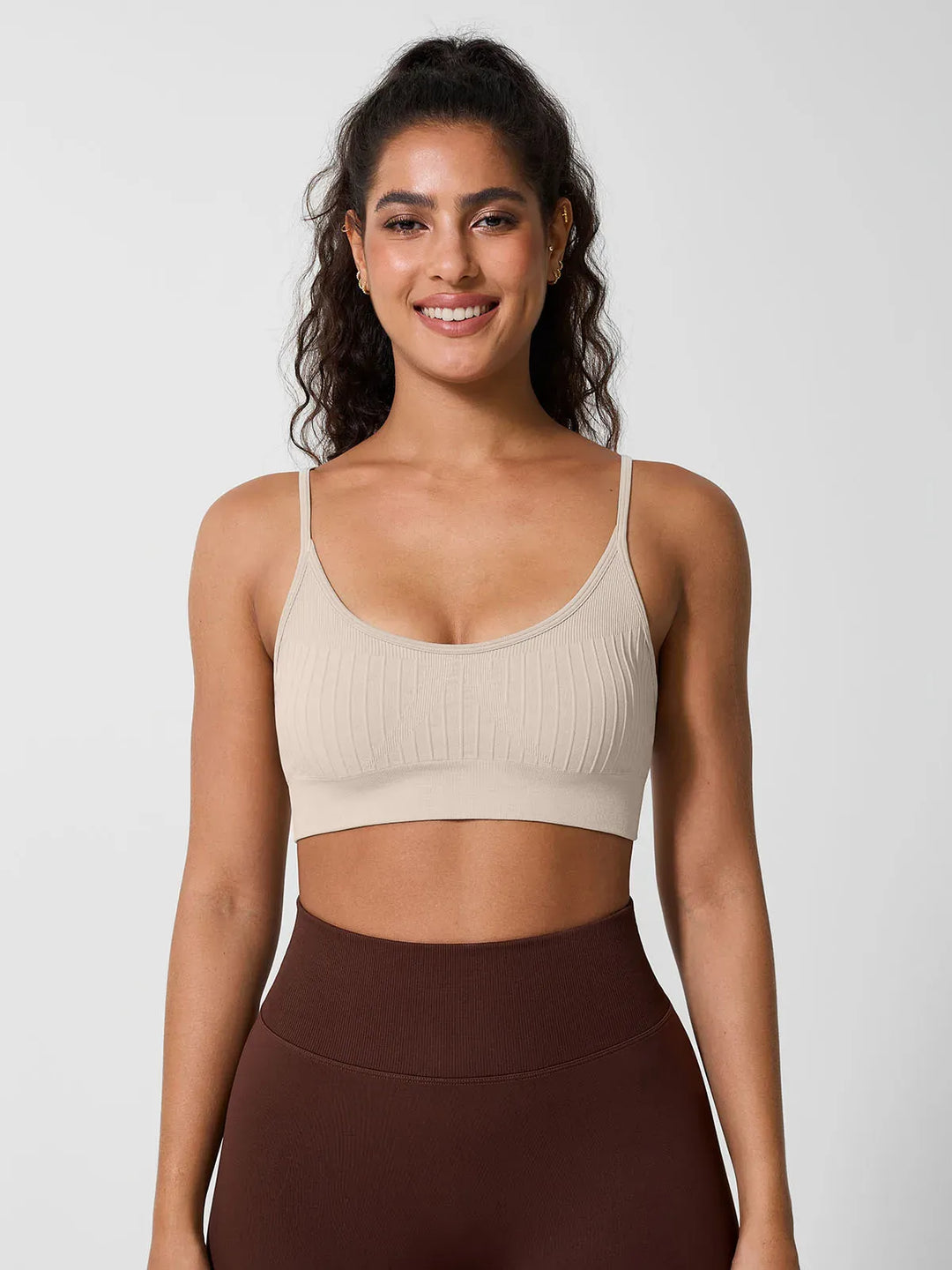 A model wearing a BRXL® Seamless Scoop Ribbed Sports Bra