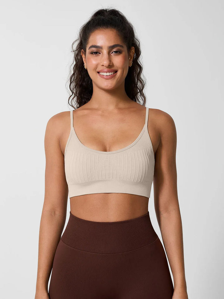 A model wearing a BRXL® Seamless Scoop Ribbed Sports Bra