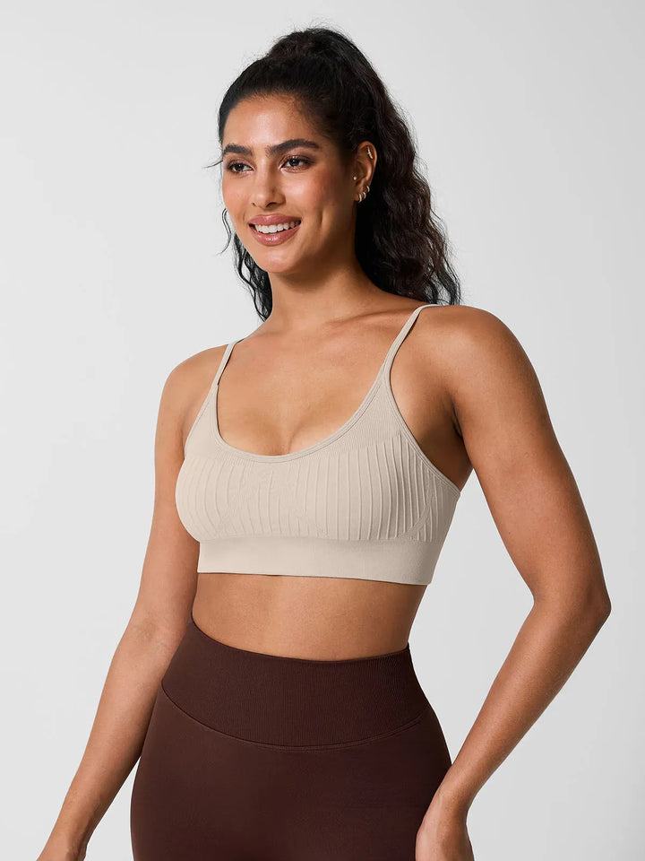 A model wearing a BRXL® Seamless Scoop Ribbed Sports Bra