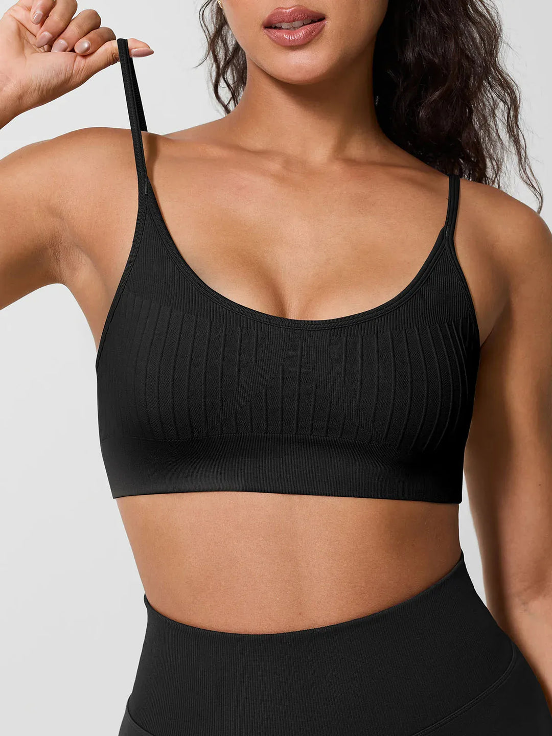 A model wearing a BRXL® Seamless Scoop Ribbed Sports Bra