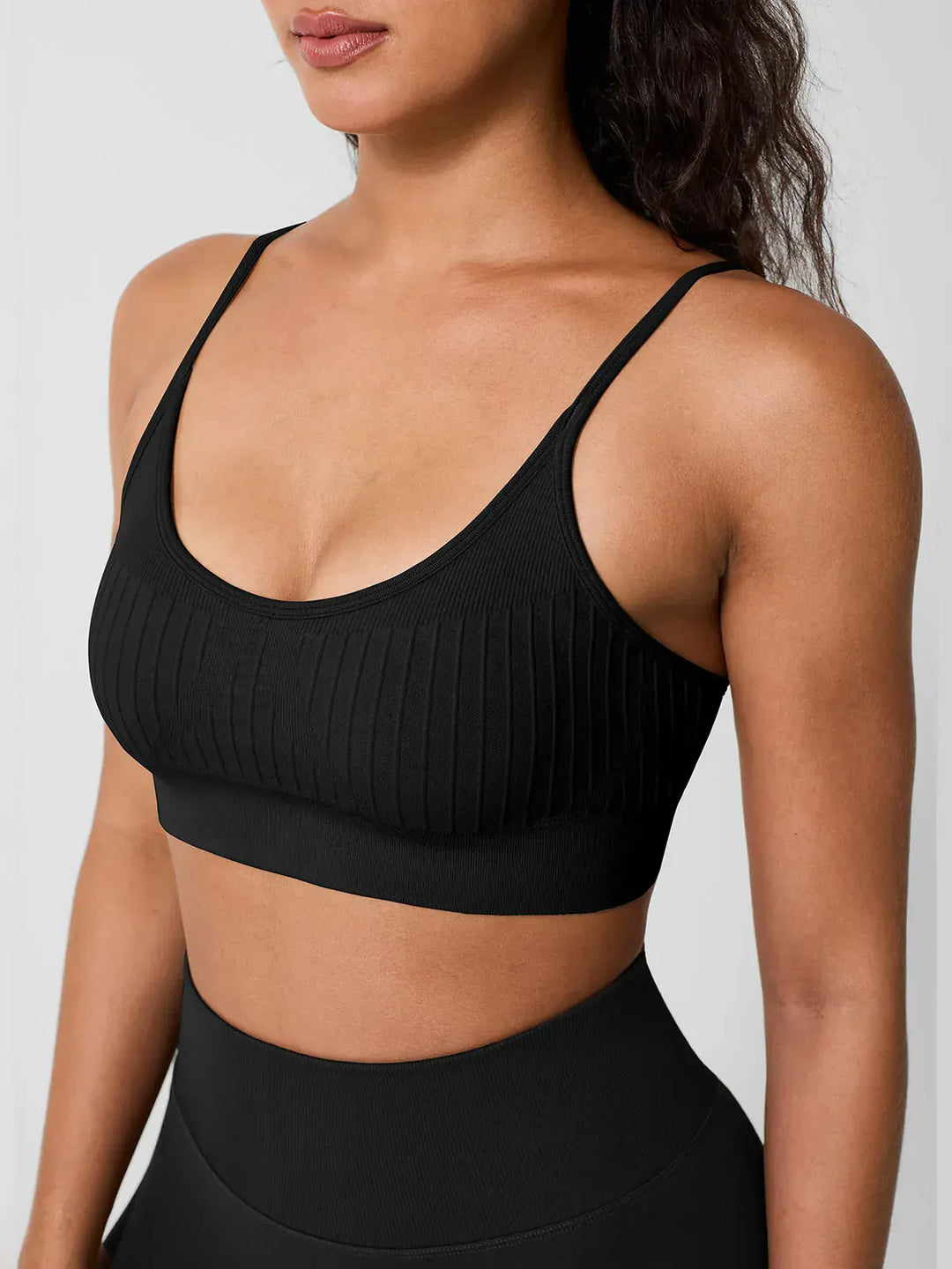 A model wearing a BRXL® Seamless Scoop Ribbed Sports Bra