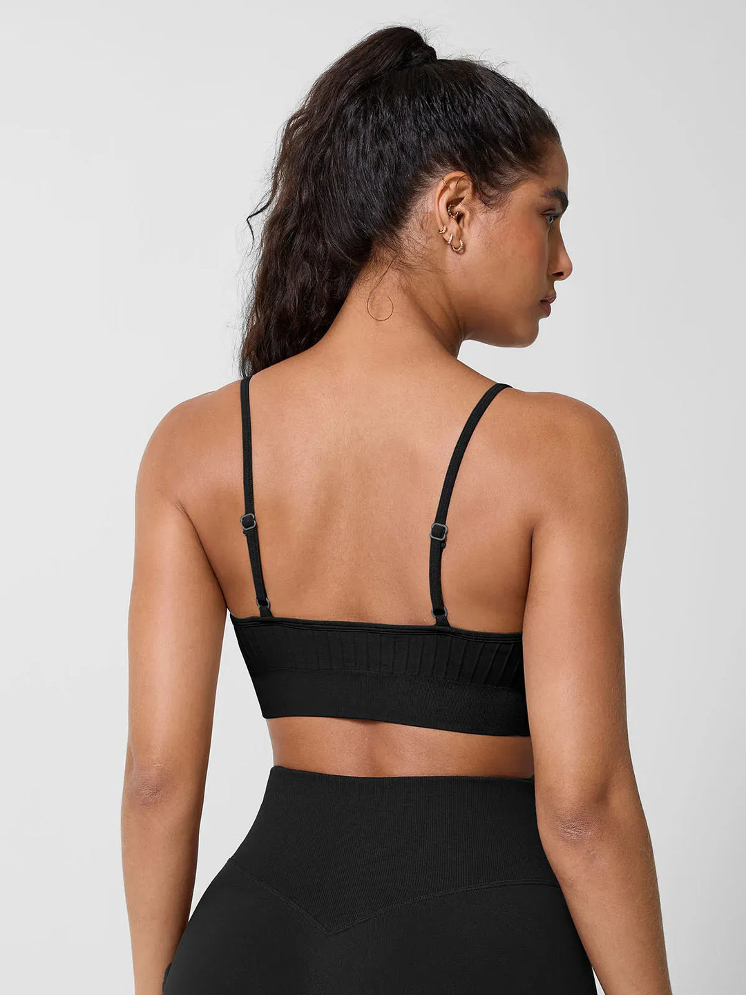 A model wearing a BRXL® Seamless Scoop Ribbed Sports Bra