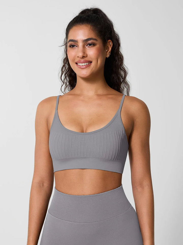 A model wearing a BRXL® Seamless Scoop Ribbed Sports Bra Grey / XS