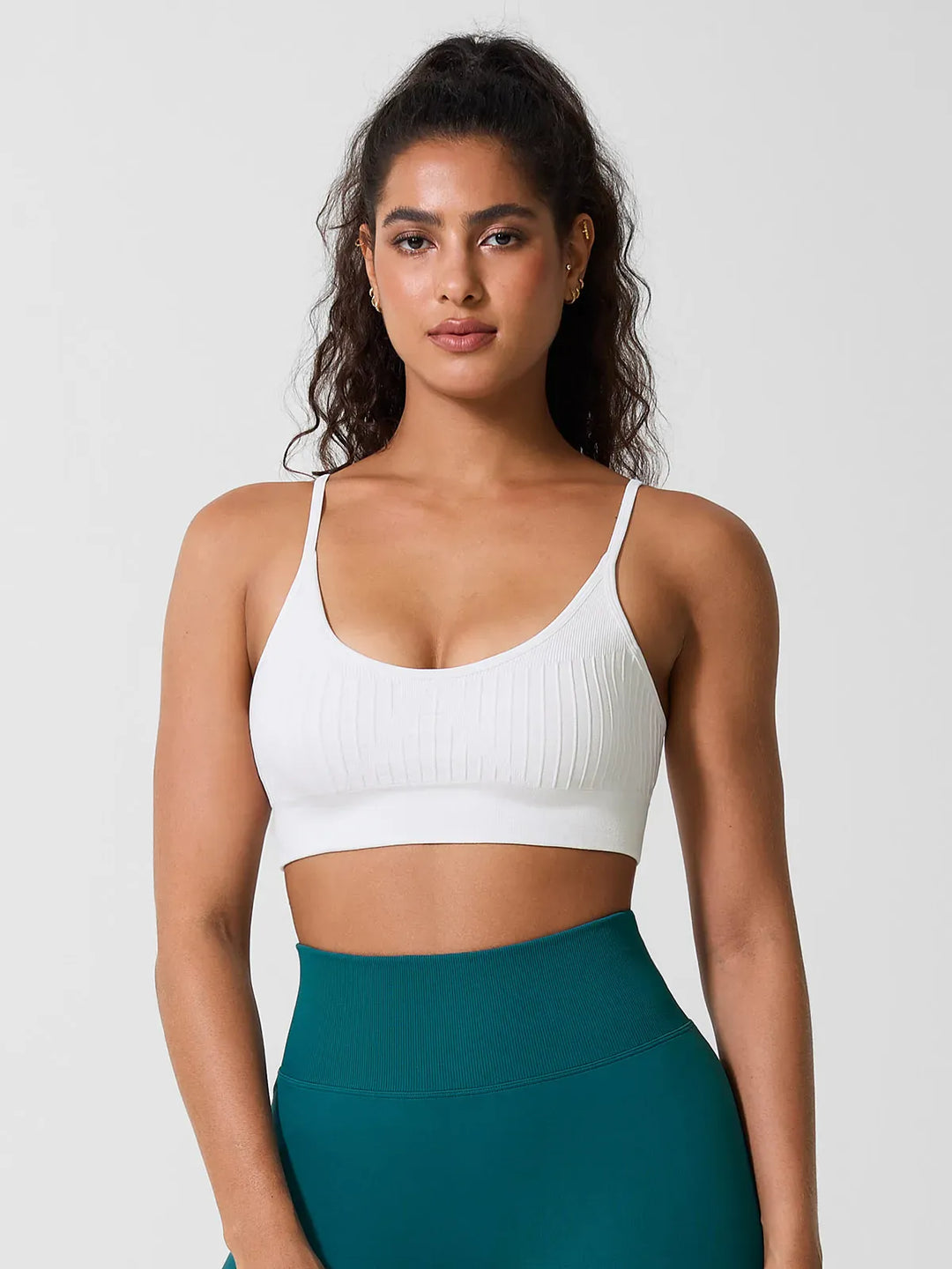 A model wearing a BRXL® Seamless Scoop Ribbed Sports Bra White / XS