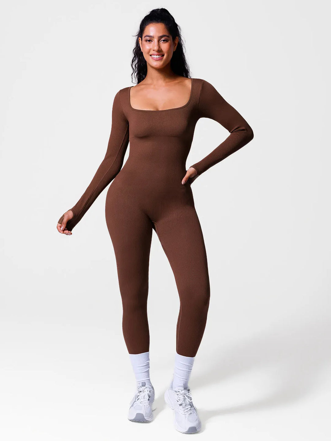 A model wearing a BRXL® Seamless Square Neck Tummy Control Jumpsuits in Long Sleeve / Brown / XS