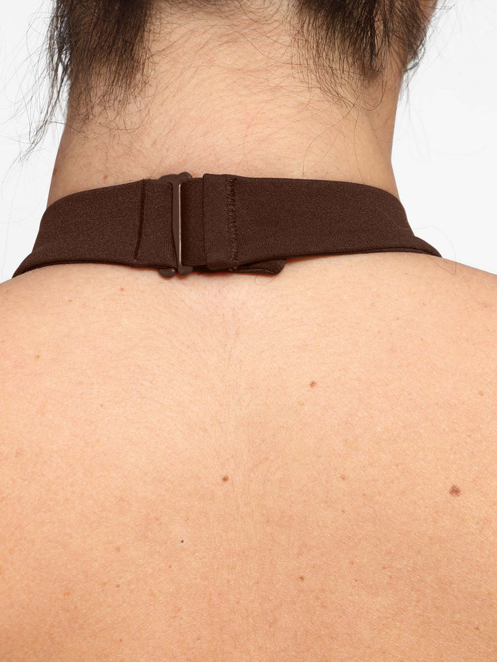 A model wearing a BRXL® Shapewear Body-Sculpting Halter Neck Jumpsuit in