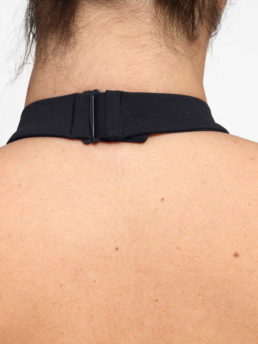 A model wearing a BRXL® Shapewear Body-Sculpting Halter Neck Jumpsuit in