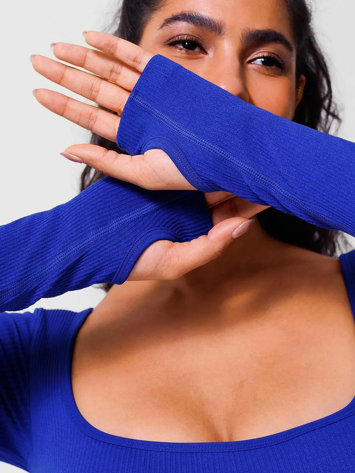 A model wearing a BRXL® Yoga Activewear Jumpsuit Winter Shapewear Long Sleeve Thumb Hole Jumpsuit in