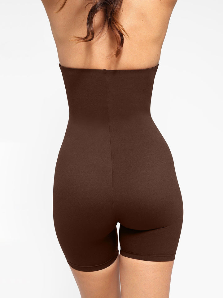 A model wearing a BRXL® Shapewear Sculpting Cutaway Halter Romper in