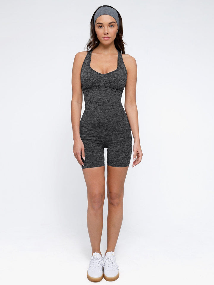 A model wearing a BRXL® Shapewear Seamless Sport Crossback Romper in