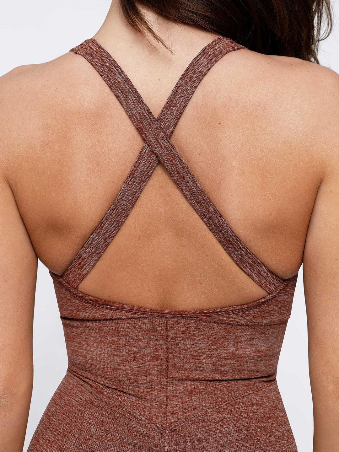 A model wearing a BRXL® Shapewear Seamless Sport Crossback Romper in