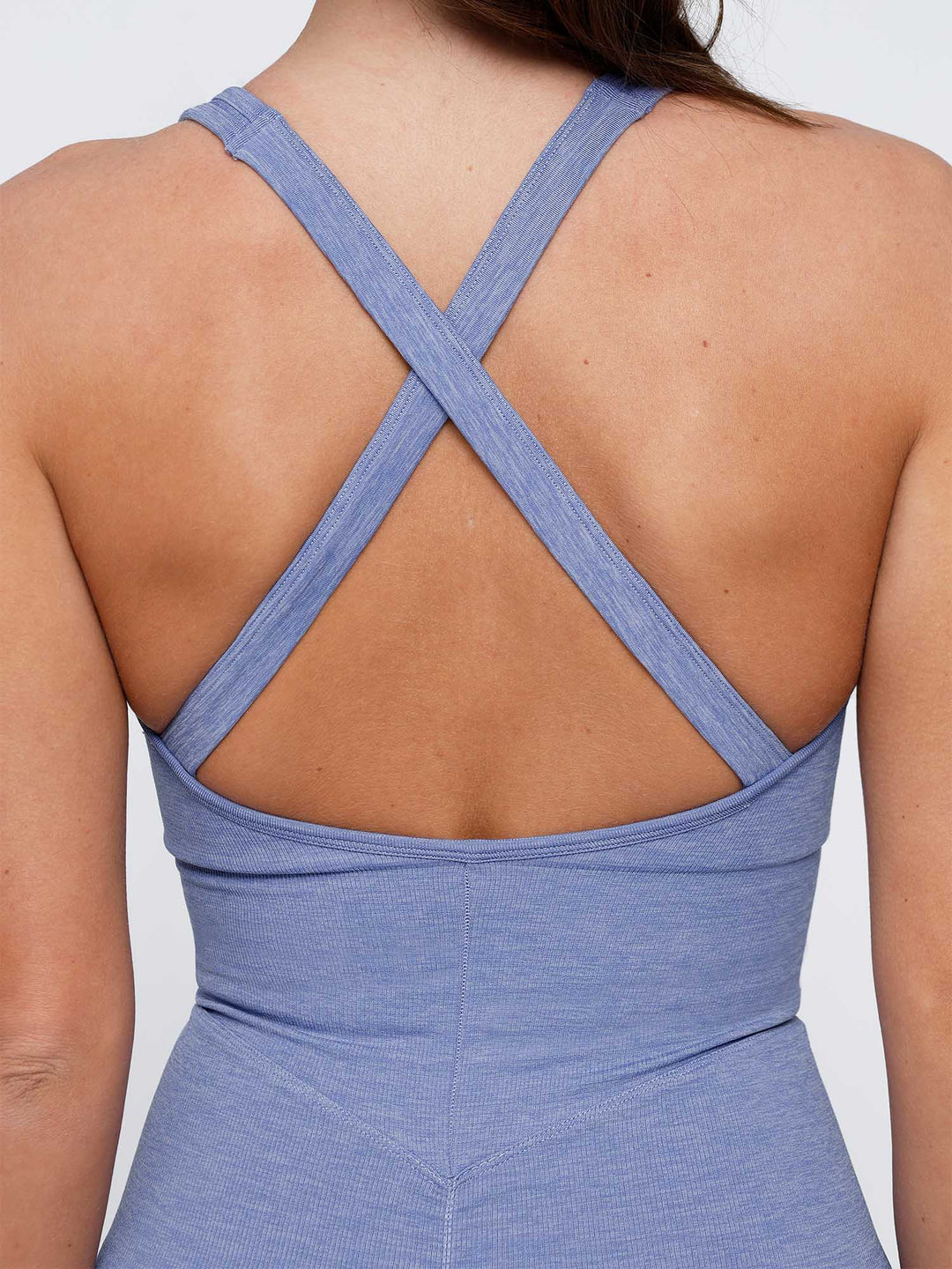 A model wearing a BRXL® Shapewear Seamless Sport Crossback Romper in