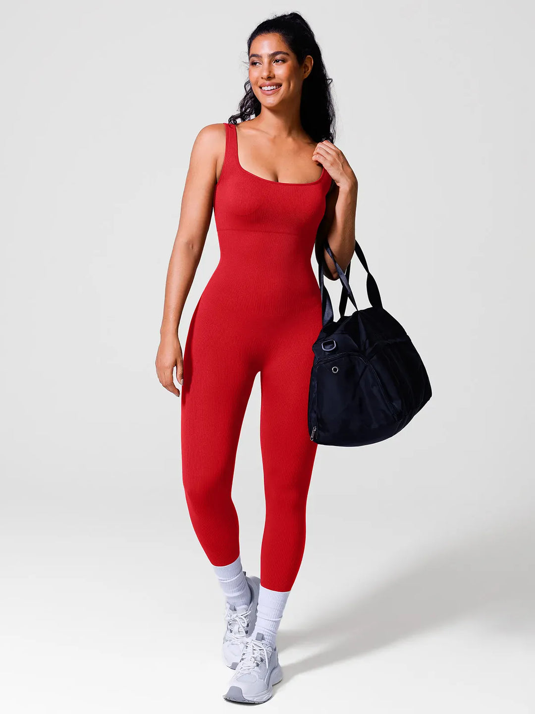 A model wearing a BRXL® Yoga Activewear Jumpsuit Shapewear Seamless Square Neck Tank Workout Jumpsuit in