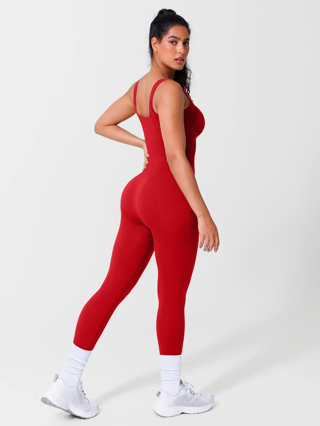 A model wearing a BRXL® Yoga Activewear Jumpsuit Shapewear Seamless Square Neck Tank Workout Jumpsuit in