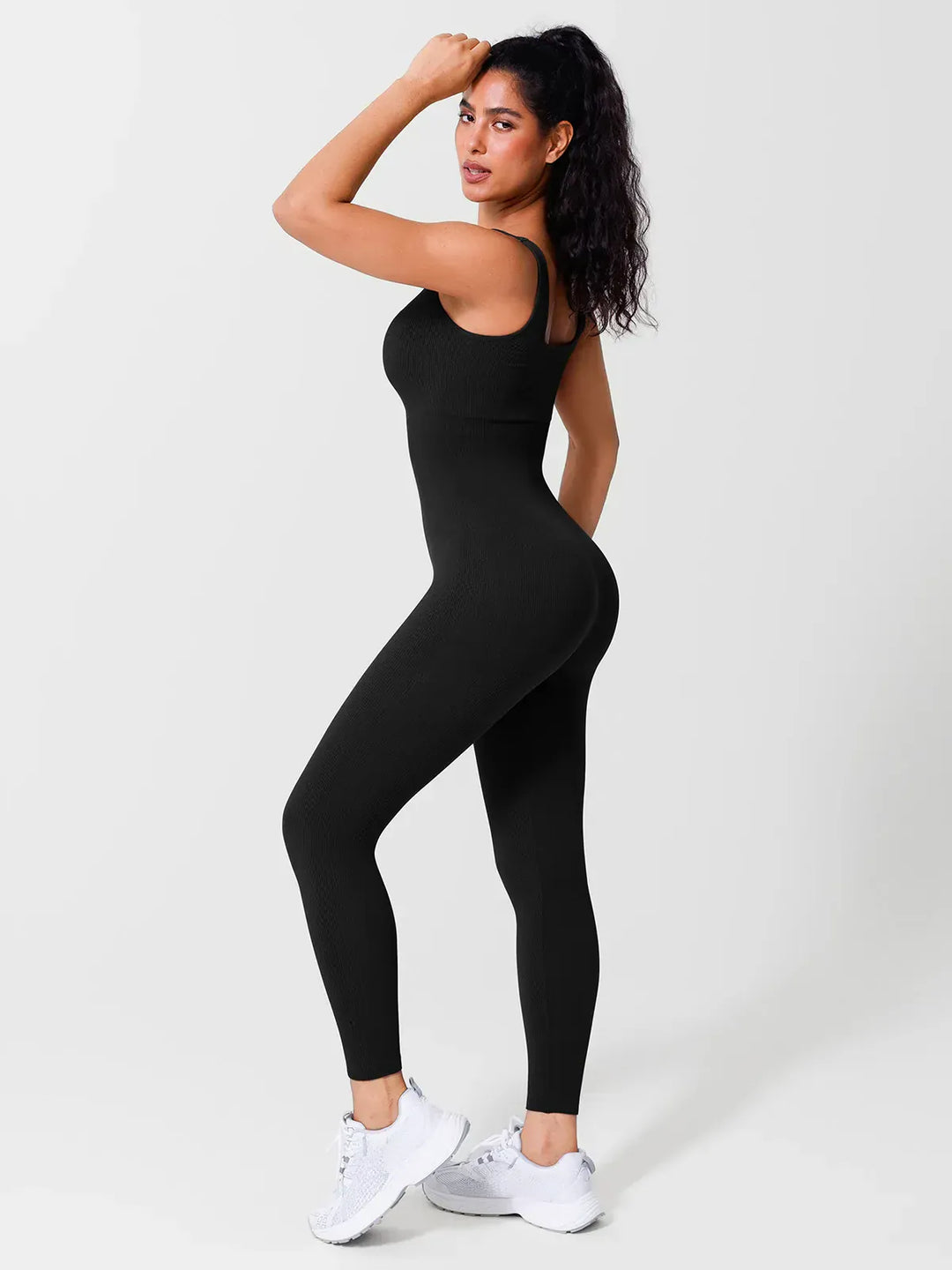 A model wearing a BRXL® Yoga Activewear Jumpsuit Shapewear Seamless Square Neck Tank Workout Jumpsuit in