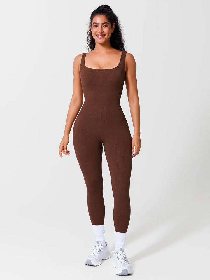 A model wearing a BRXL® Yoga Activewear Jumpsuit Shapewear Seamless Square Neck Tank Workout Jumpsuit in Brown / S