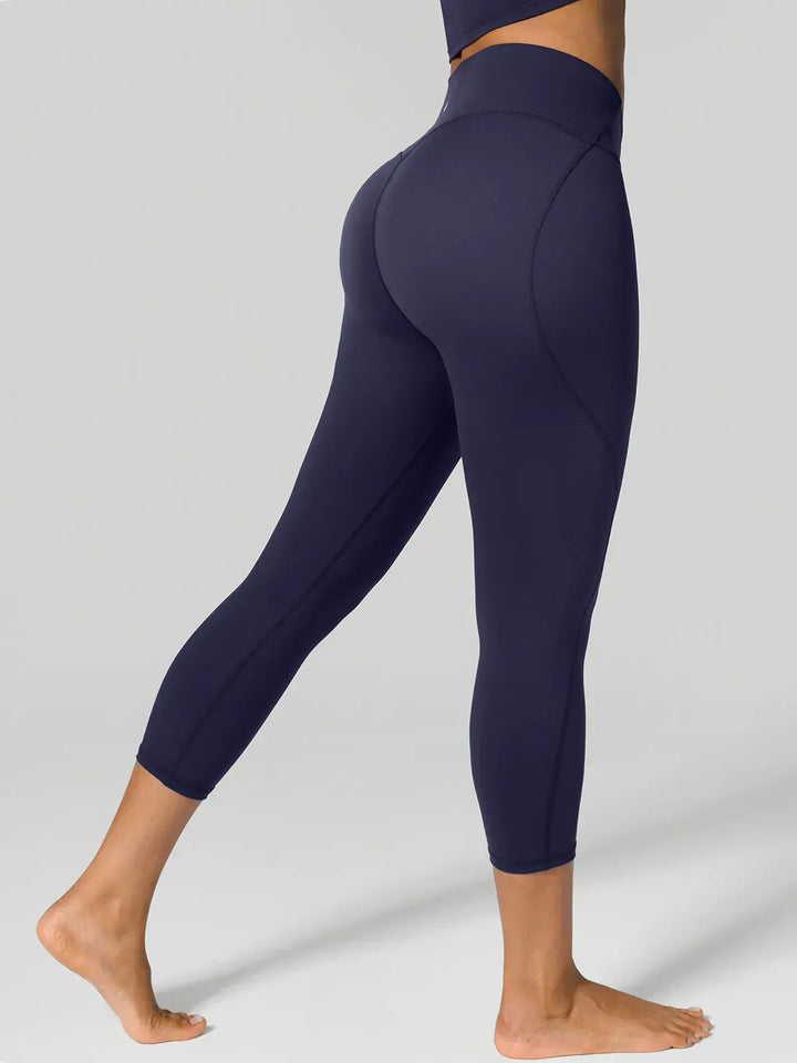 A model wearing a BRXL® Shapewear Yoga 7/8  Leggings in