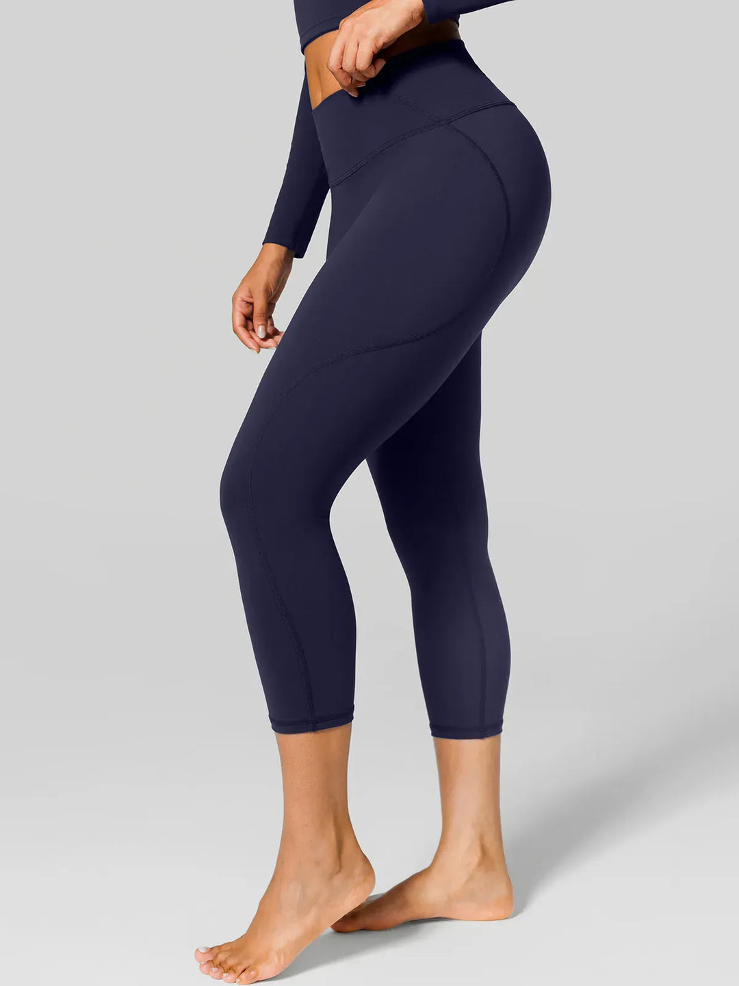 A model wearing a BRXL® Shapewear Yoga 7/8  Leggings in