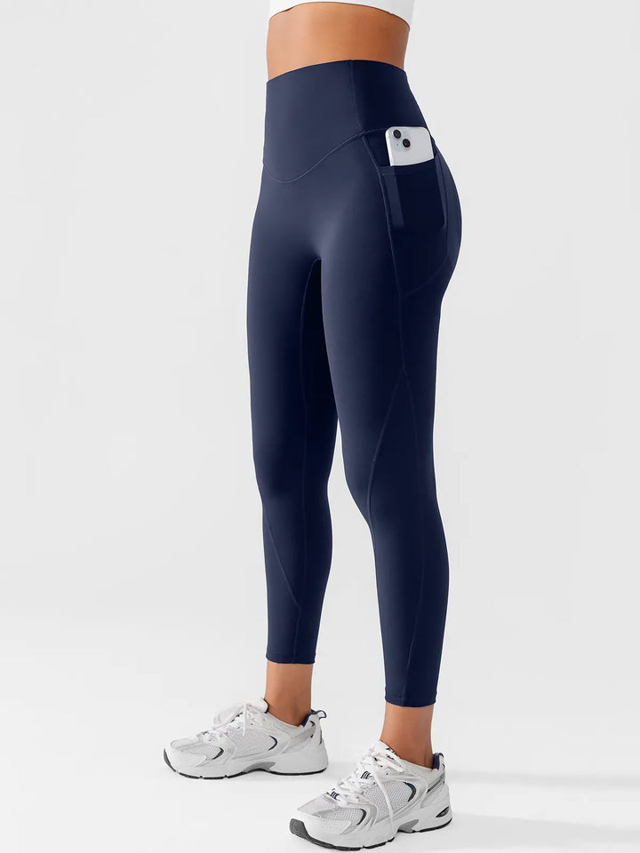 A model wearing a BRXL® Side Pocket Butt-Lift Leggings in