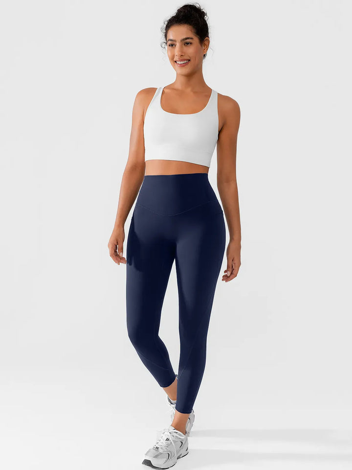 A model wearing a BRXL® Side Pocket Butt-Lift Leggings in