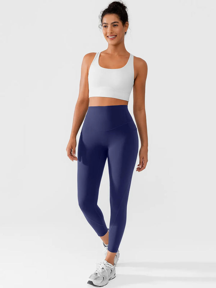 A model wearing a BRXL® Side Pocket Butt-Lift Leggings in