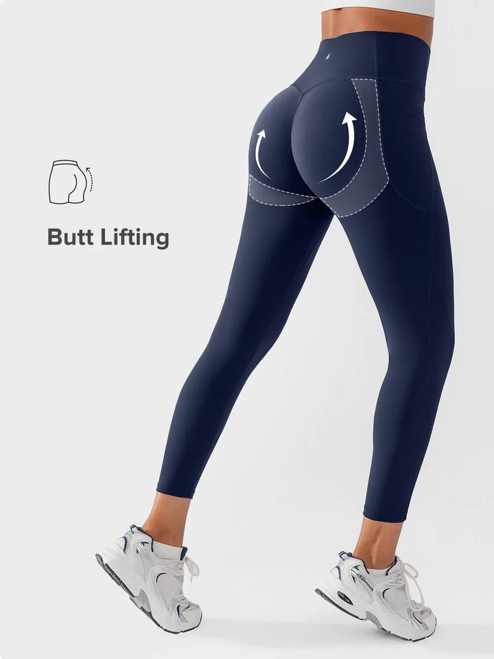 A model wearing a BRXL® Side Pocket Butt-Lift Leggings in